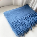 Thick solid blue mohair scarf for women featuring long tassels on a white tabletop - Fog Blue (15#)