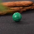 Single 20mm round malachite crystal ball with natural green textures on dark base - 20*20mm / Malachite