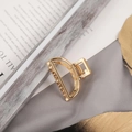 Detail of a large golden metal hair claw clip with pearls on elegant fabric - Small Gold Semicircle