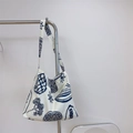 Off-white canvas tote bag featuring navy blue hand-drawn botanical print and strap - Single Crossbody Strap