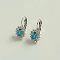Elegante silberne Sonnenblumen-Ohrringe mit himmelblauen Zirkoniasteinen und Kristallkranz - Silber mit Blauem Zirkonia
