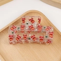 Transparent Christmas hair claw clip with festive red reindeer and green snowflake patterns - Christmas Reindeer