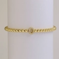 18k gold plated beaded elastic bracelet with an oval micro-pave cubic zirconia charm - Letter O