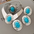 Macro detail of vintage silver jewelry set with hammered texture and oval blue stones - Set - Silver - Blue (4-piece Set)