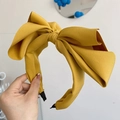 Yellow oversized bow headband in premium fabric with elegant minimalist style - Yellow