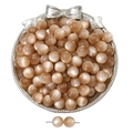 Macro view of champagne cat eye resin beads with silk luster for DIY jewelry making - Coffee