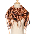 Detail of orange and black houndstooth pattern scarf with tassel fringe edges - Orange