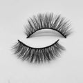 Macro shot of fluffy black false eyelashes with a thick, curved faux mink texture - D285N
