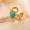 Detail of vintage gold-plated titanium steel ring with an oval turquoise stone inlay - Braided Turquoise Adjustable Style (TYR0718)