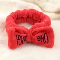 Red coral fleece headband with oversized bow and black embroidered OMG lettering - Red