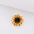 Golden sunflower enamel brooch with black textured center on a clean white background - All-Gold Sunflower