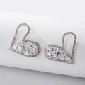 Detail view of heart shaped silver earrings with rhinestones on a white pedestal - Heart Style / Silver (925 Sterling Silver Earring Post)