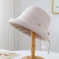 Detail of light beige bucket hat showing woven texture and elegant side drawstring - M (56-58cm) / Off White