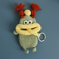 Handmade green crochet monster key cover with orange braids and yellow scarf - Avocado Sausage Mouth
