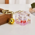 Fortune cat keychain with purple glitter in a transparent acrylic cube and gold bell - Lucky Cat (Purple)