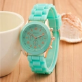 Detail view of teal silicone strap watch with rose gold case on a wooden background - Mint Green