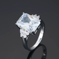 Silver ring with rectangular clear stone and side accents on a dark reflective surface - Platinum Gold [white Diamond] Ljz-232 / Adjustable Open