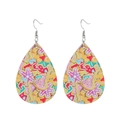 Detail of teardrop leather earrings with yellow gingerbread and candy cane patterns - Yellow Gingerbread Sweets