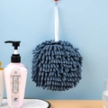 Absorbent navy blue chenille hand towel ball with hanging loop in a bathroom setting - Navy Blue