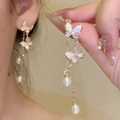 Elegant gold bow earrings with mother-of-pearl butterfly and pearl fringe pendants - Gold Butterfly Shell Pearl
