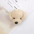 Close-up of beige plush teddy dog charm with curly fur texture and hanging loop detail - Off-white