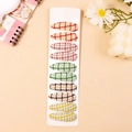 Set of 10 floral fabric houndstooth snap hair clips for kids on a white display card - Combination 12