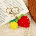 Handmade crochet strawberry and pineapple fruit keychains with golden lobster clasps - Style 7