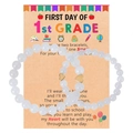 Detail of white stone beaded bracelets with gold hearts on a 1st Grade school card - White