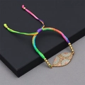 Detail of colorful woven Evil Eye bracelet with pavé rhinestones and adjustable cord - Woven Rope Evil Eye Bracelet / Multicolor/Rainbow