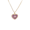 Detail of gold heart pendant with purple enamel eye motif and zircon setting - Purple