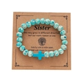 Blue and white spotted beaded bracelet with a cross charm on a sister message card - Blue White Spotted Blue Cross Card Bracelet