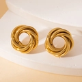 Macro view of gold intertwined knot stud earrings on a minimalist stone display pedestal - Gold Large Twisted Wrap Studs (BJGE0722)