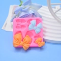 Roze siliconen fondantvorm met vier strikontwerpen voor DIY taartdecoratie - 4-Gaten Strik Stijl(138#)