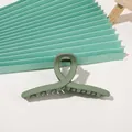 Detailed view of matte Morandi green shark hair claw clip with cross-twist design - Matte Cross - Army Green