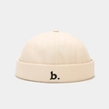Cream-colored brimless docker hat featuring minimalist black b letter embroidery - Adjustable / Beige