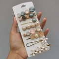 Detailed view of candy color hair clips set with artificial pearls and resin floral designs - Elegant White (8 Piece Set)