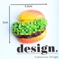 Macro shot of 5.4cm resin hamburger fridge magnet showing layers of lettuce and meat - Vegetable Burger