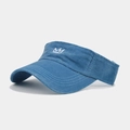 Detailed view of white crown embroidery on a blue washed cotton open-top sun visor cap - Adjustable / Lake Blue