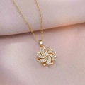 Detail of spinning sunflower pendant with sparkling cubic zirconia on a gold chain - X2843 Gold Flower Rotating