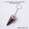 Realistic sushi hand roll keychain featuring seaweed, rice, and orange roe details - Meat Paste Sushi-Keychain