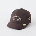 Detailed view of dog embroidery and slogan on deep brown baby soft brim baseball cap - 50cm (1-3 Years) / Brown