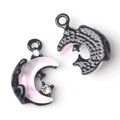 Macro detail of moon-shaped charms showing pearlescent inlay and black metal texture - Black Base Pink