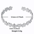 Silver flower cuff bracelet in stainless steel with daisy cutout design and open ends - Steel