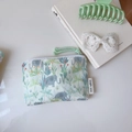 Close-up of cotton mini pouch with elephant and tropical leaf print with zipper detail - Green Leaf Elephant