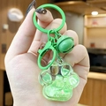 Cute green cat paw keychain with liquid quicksand and colorful letter charms - Green Cat Paw Letter Beads