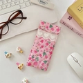 Close-up of pink floral padded glasses pouch with lace trim and heart embroidery details - Girl Portrait