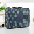 Blue travel toiletry bag with green geometric patterns and a convenient carry handle - Navy Stars