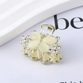 Macro shot of gold butterfly hair claw with rhinestones and white cat eye stones - 11# Rhinestone Butterfly Claw Clip