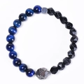 Detailed close-up of blue tiger eye stone beads and faceted black beads on elastic bracelet - Blue Tiger Eye & Faceted Black Bead Bracelet