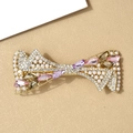 Elegant gold hair clip with crystal rhinestones, pearls and pink gemstones in a bow design - Qing Ni Colorful